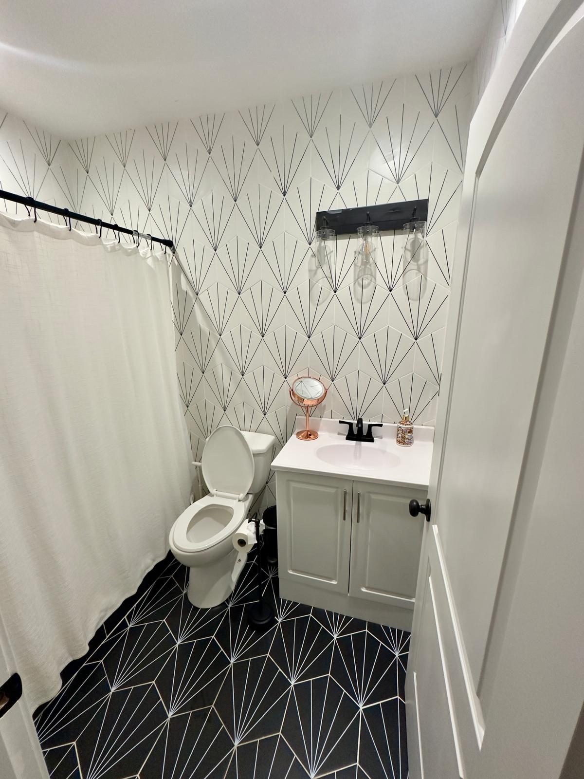 Finished bathroom with patterned tile