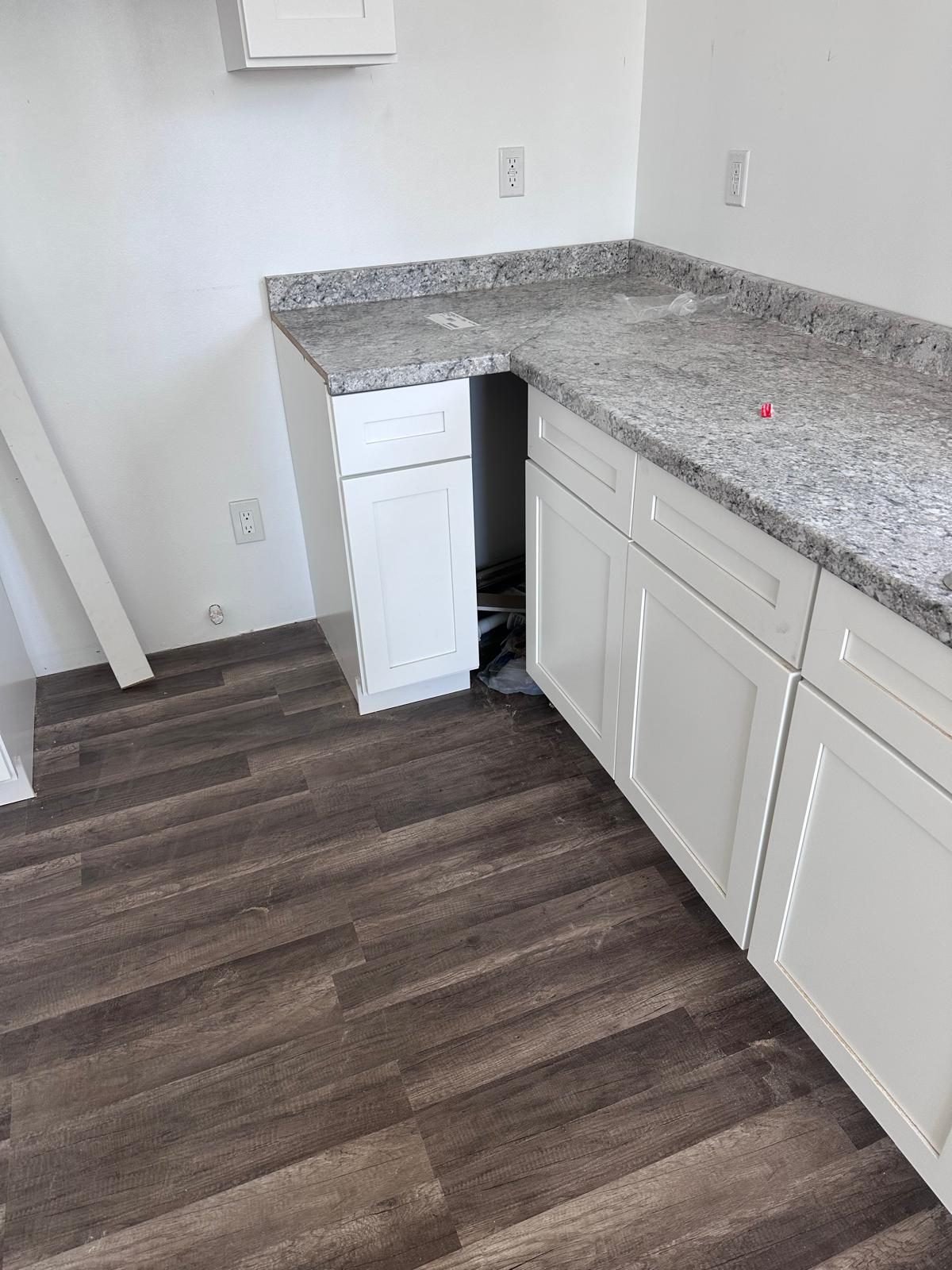 Granite kitchen counters being installed